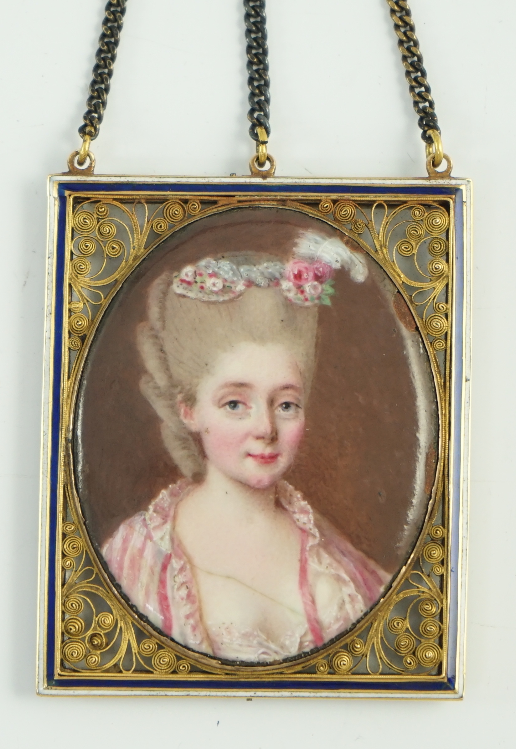 French School circa 1780, Portrait miniature of a lady with flowers in her coiffure, enamel on copper, 4 x 3.2cm.